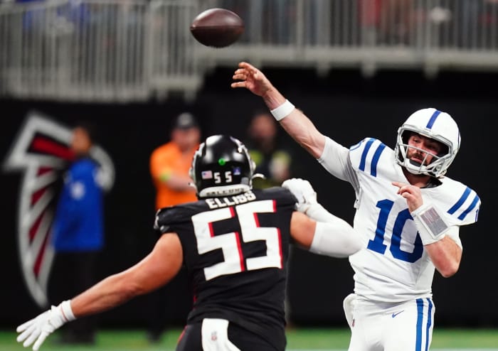 Dec 24, 2023; Atlanta, Georgia, USA; Indianapolis Colts quarterback Gardner Minshew (10) passing under pressure from Atlanta Falcons linebacker Kaden Elliss (55) during the second half at Mercedes-Benz Stadium.